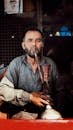 Portrait of a Man Smoking Hookah in Pahalgam
