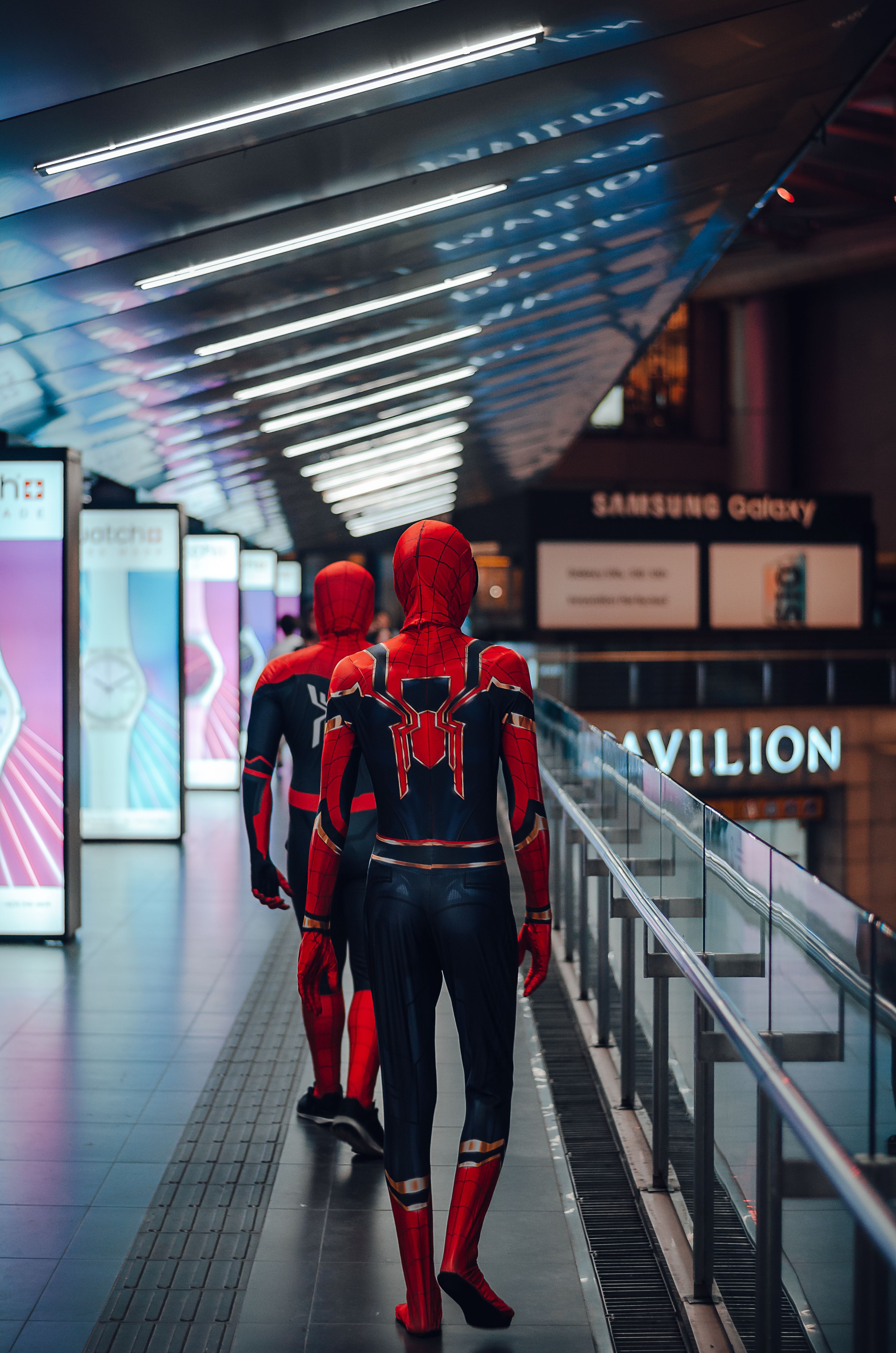 people-wearing-spider-man-adult-costume-walking-on-train-station-free