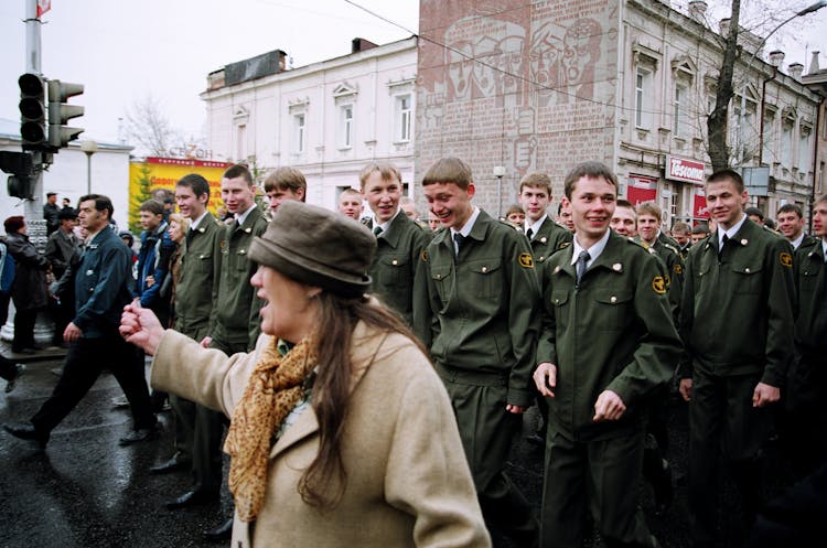 Military Personnel Walking Down Road