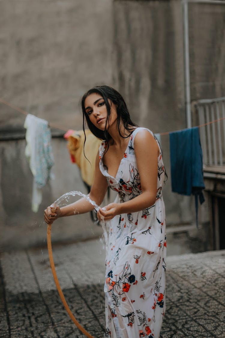 Woman Holding Water Hose