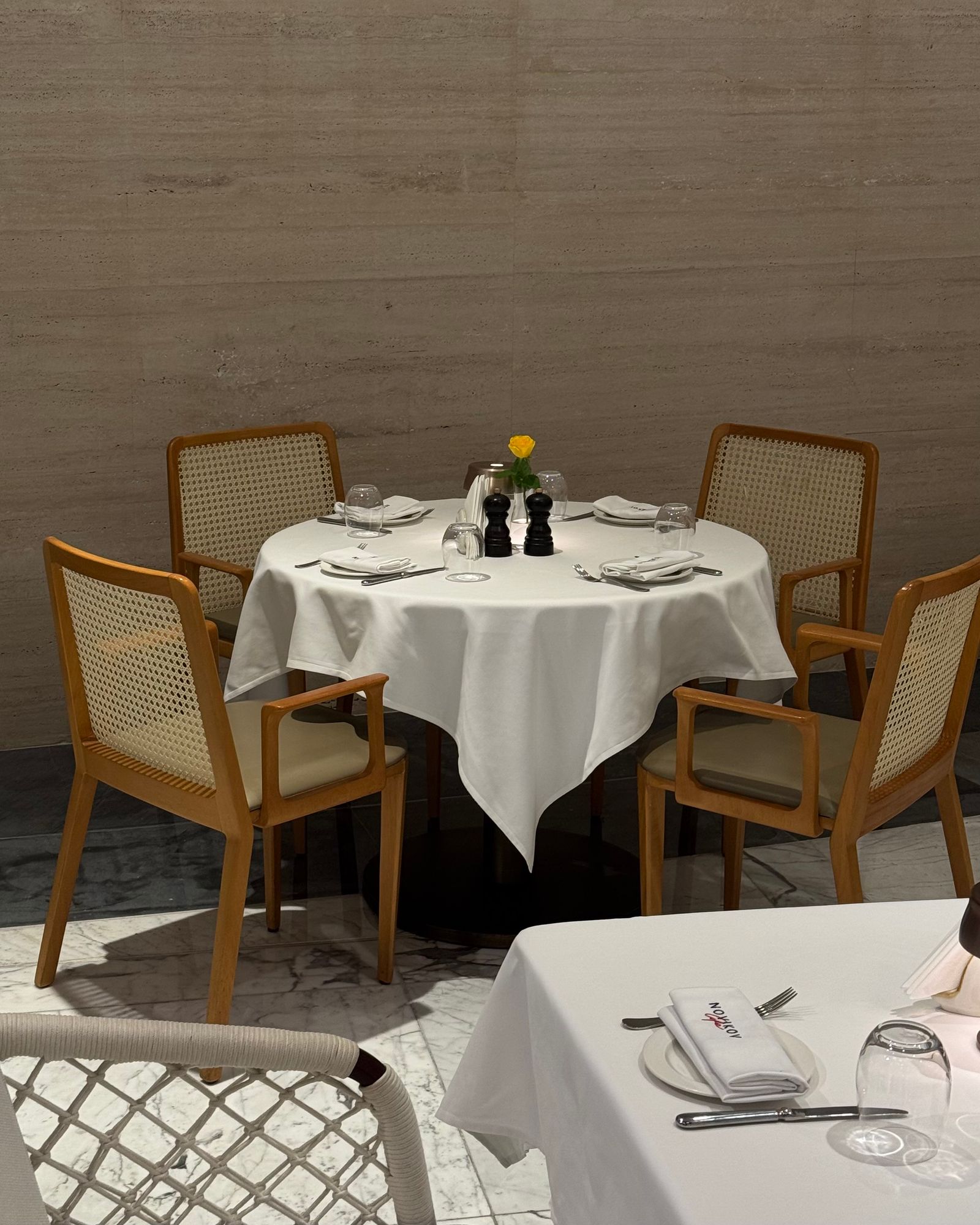 An elegant empty restaurant table. Photograph by aju.bee via Pexels.