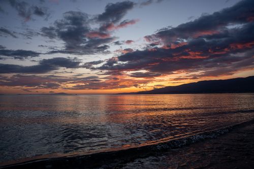 Free Beautiful sunset over the Aegean Sea with colorful skies and tranquil waters in Balıkesir, Türkiye. Stock Photo