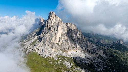 Free Breathtaking view of Dolomite mountains with blue sky and clouds in Italy. Stock Photo