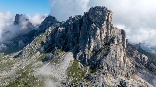 Free Stunning view of rugged Dolomite mountains with clouds and blue skies. Stock Photo