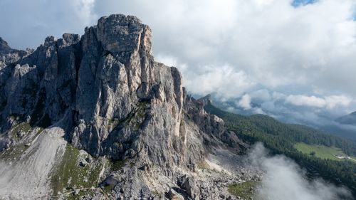 Free Breathtaking view of rocky peaks surrounded by clouds in the Italian Alps. Stock Photo