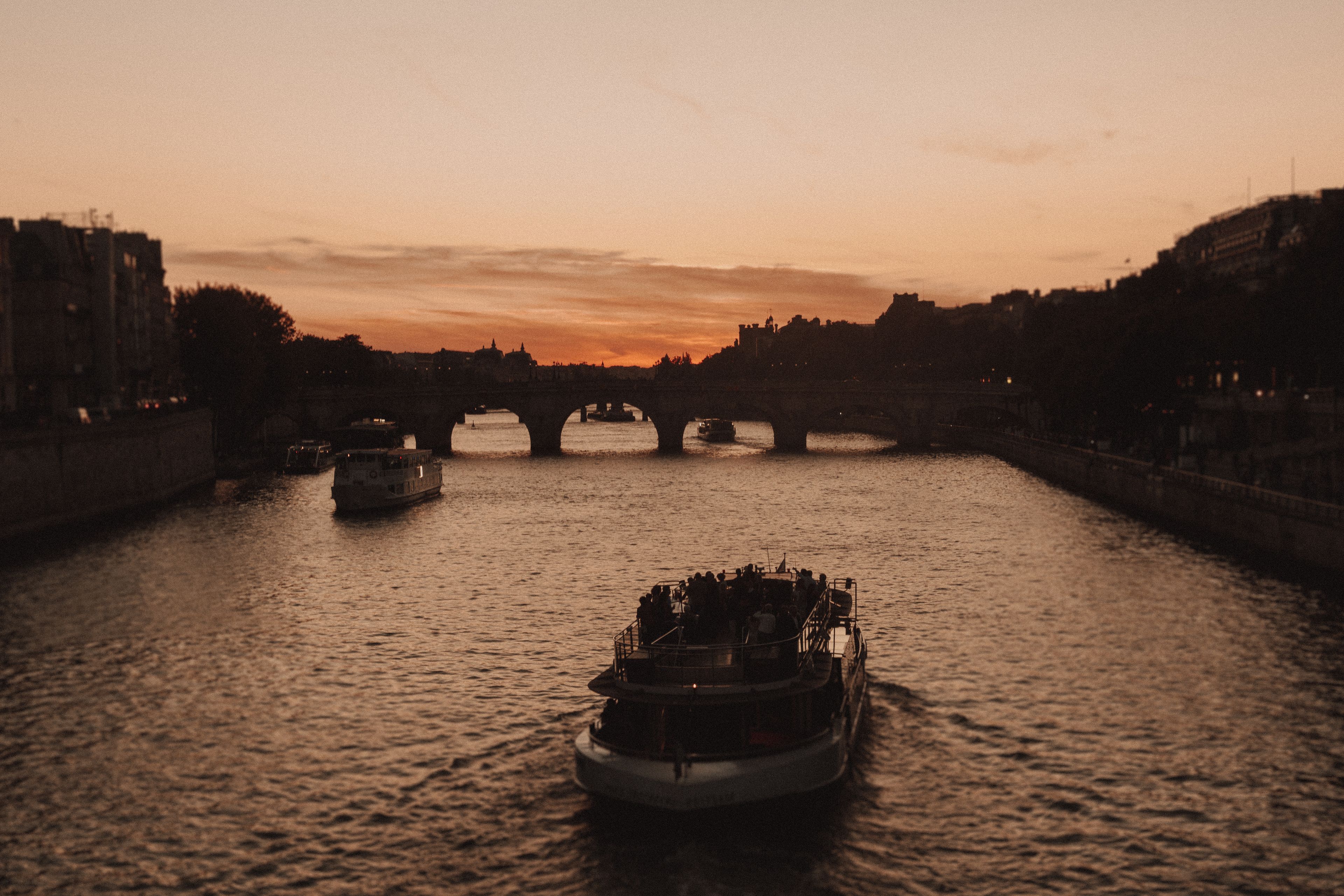 Romantic Seine dinner cruise on a small candlelit barge in Paris at sunset