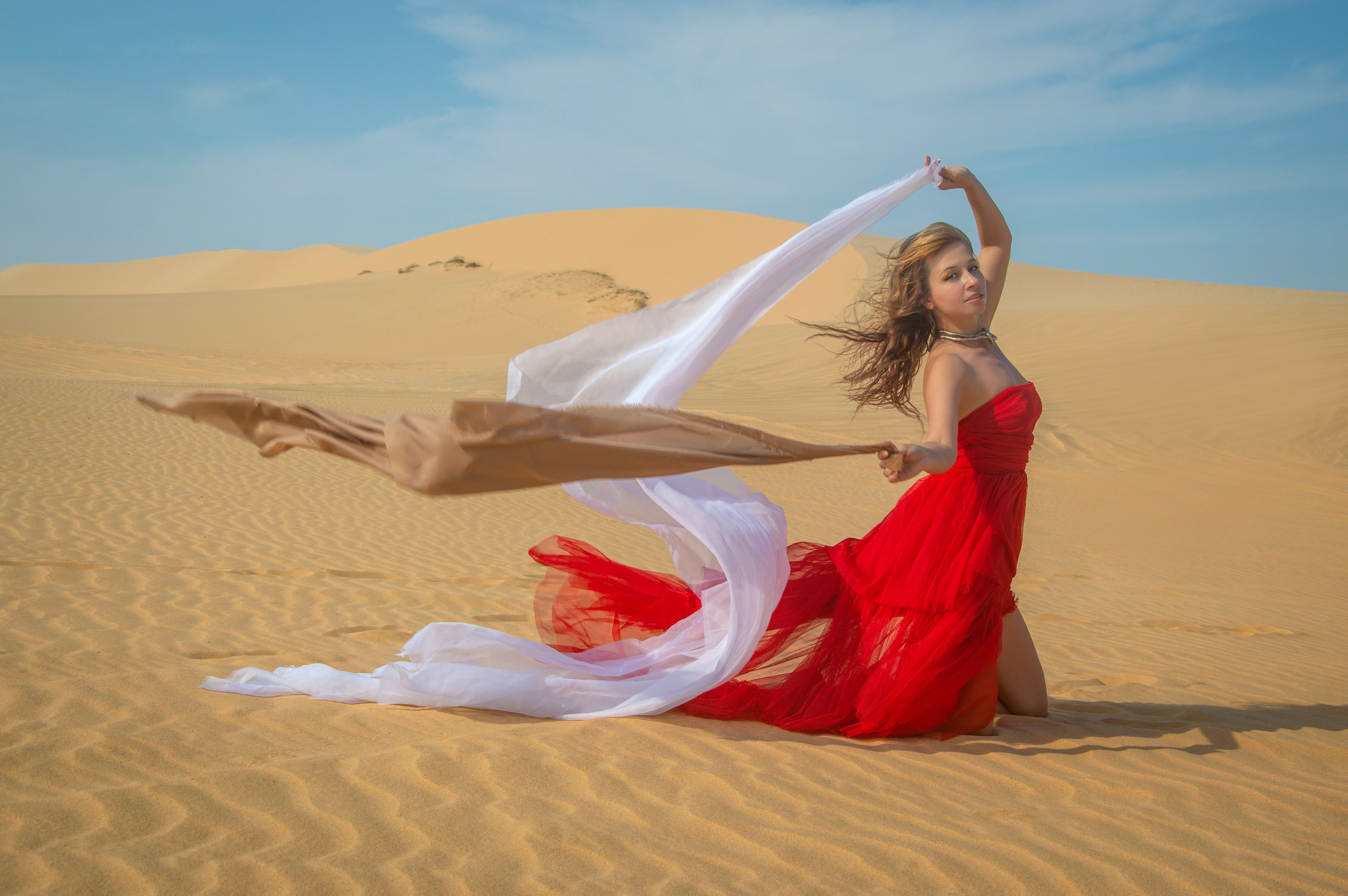 Woman in Red Dress in Desert Landscape  Free Stock Photo
