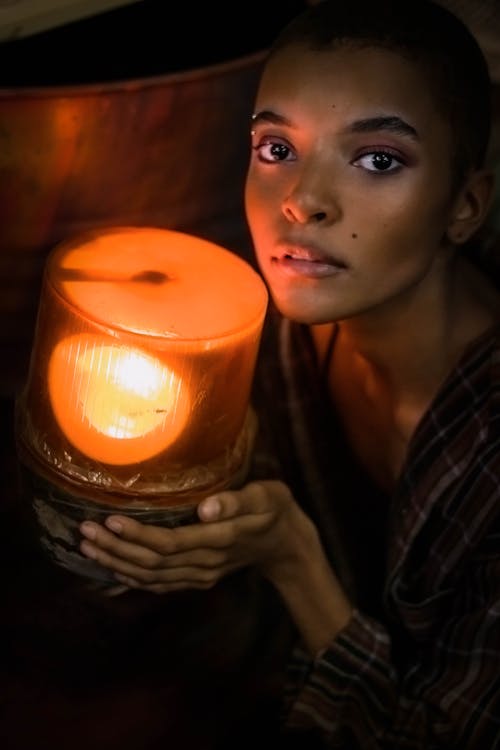 woman Holding Lamp