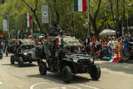 Military vehicles in a parade on Avenida Reforma, Mexico City.