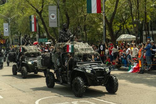 Free Military vehicles in a parade on Avenida Reforma, Mexico City. Stock Photo