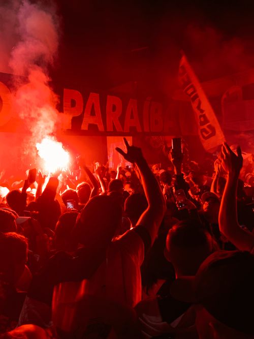 Free Vibrant night celebration with crowd and flares in Paraíba, Brazil. Stock Photo