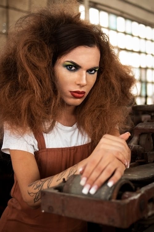 Woman Holding Black Metal Mahcine