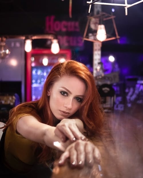 Woman Leaning on Counter Table