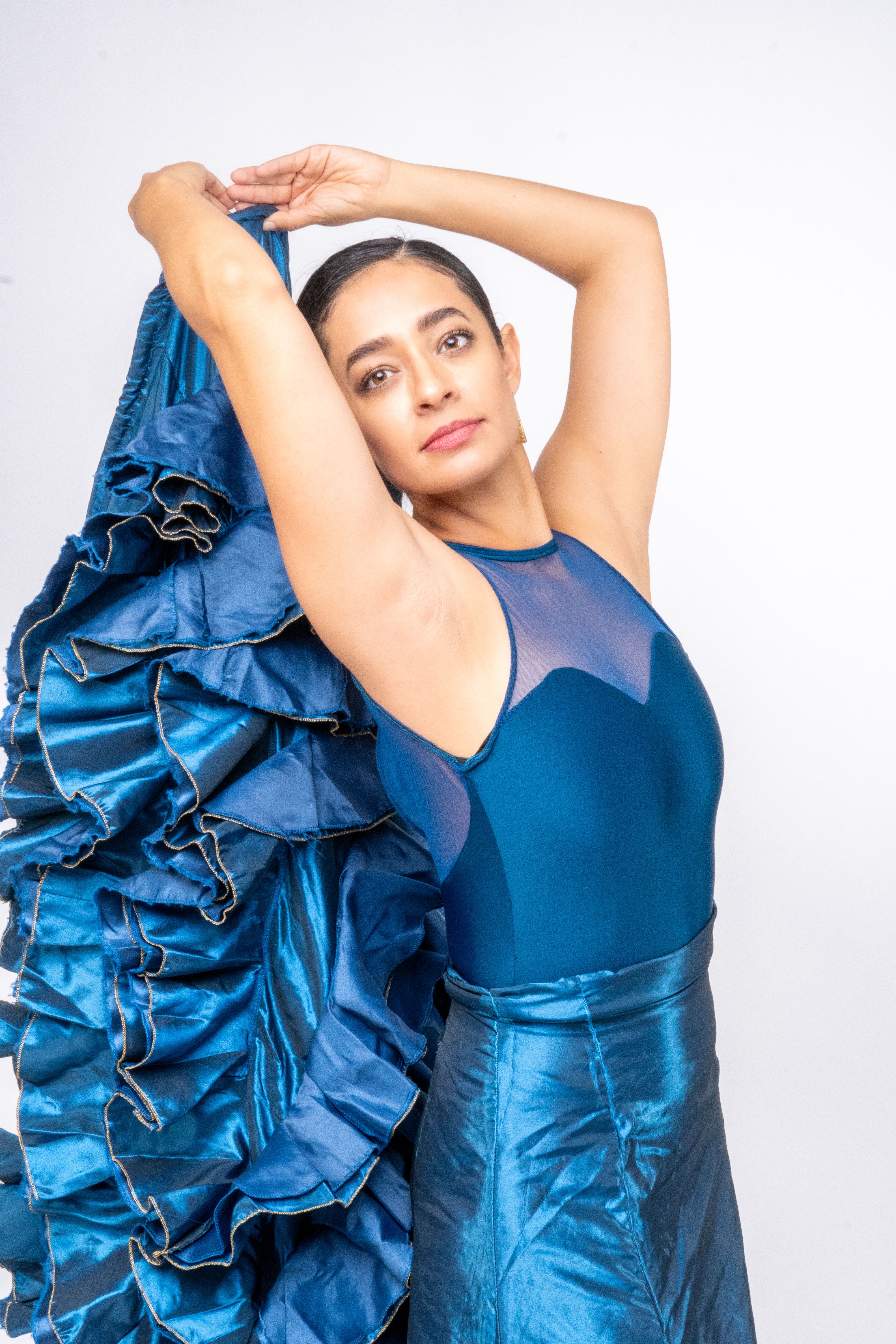 Elegant Woman Posing in Vibrant Blue Flamenco Dress  Free Stock Photo