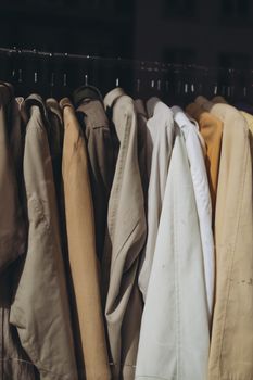 A selection of various jackets displayed in a retail clothing store setting.