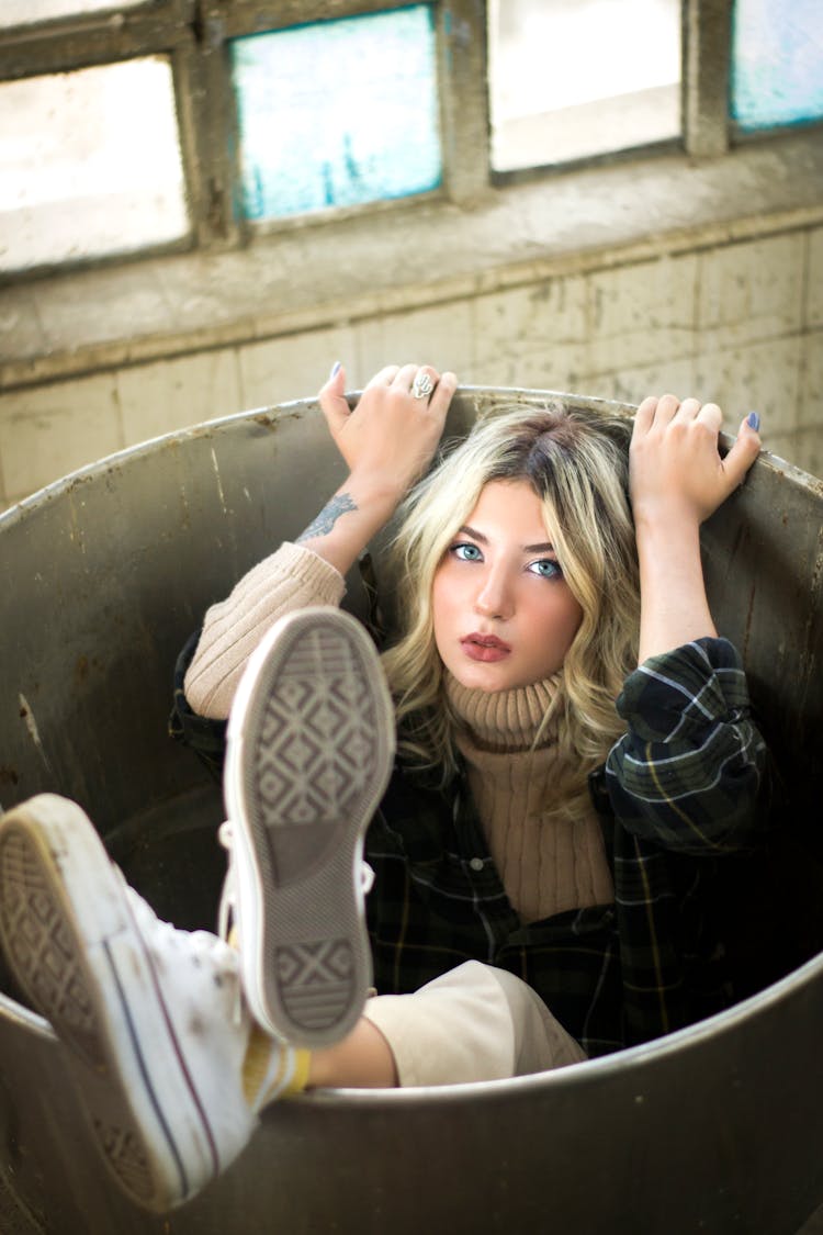 Woman Sitting Inside Drum