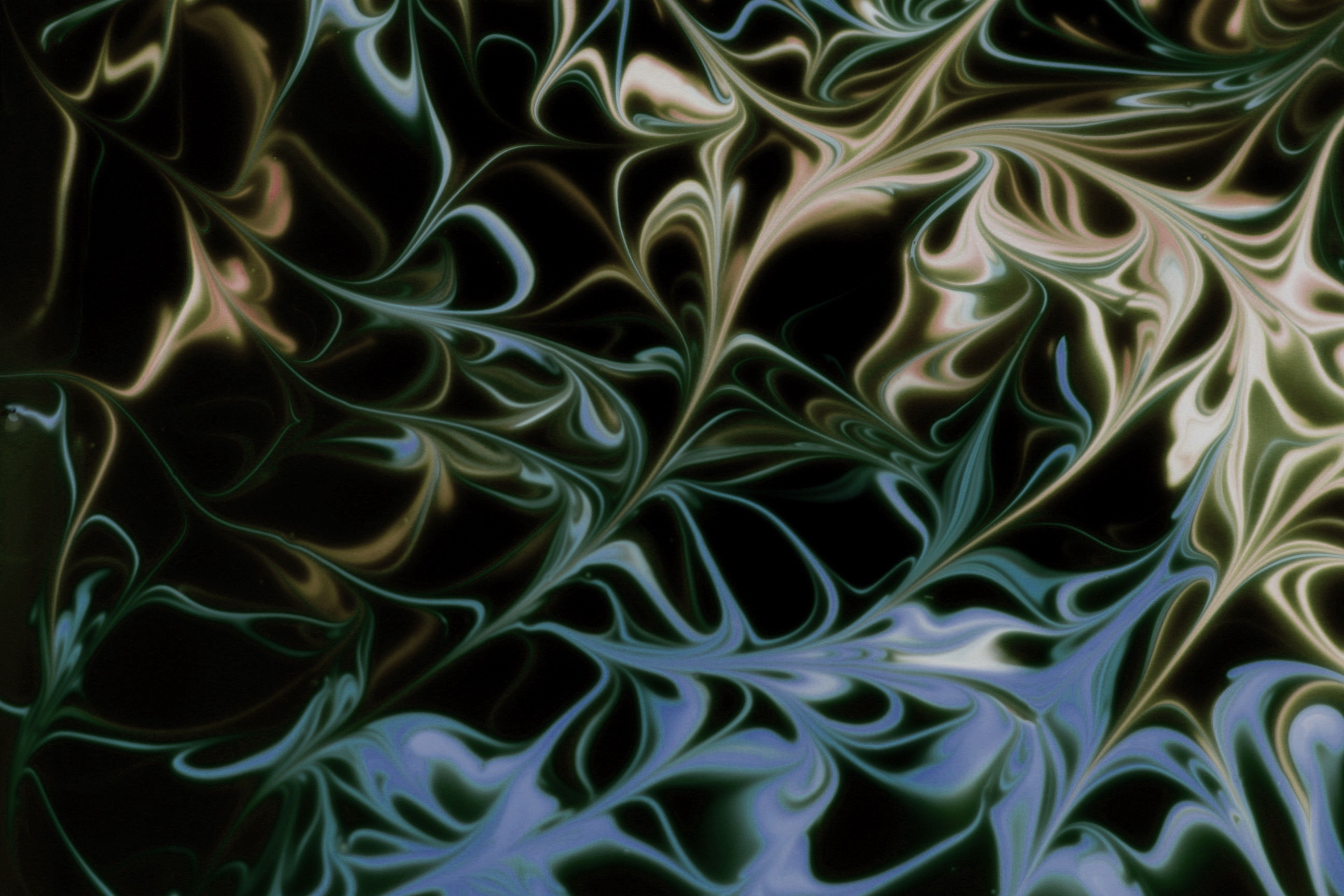 Intricate marbled pattern with swirling curves in dark and light tones. Perfect for abstract art lovers.