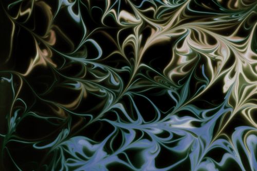 Free Intricate marbled pattern with swirling curves in dark and light tones. Perfect for abstract art lovers. Stock Photo