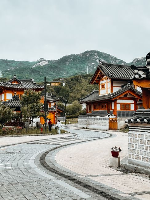 Charming traditional Korean village scene with scenic mountain backdrop in Seoul, South Korea.