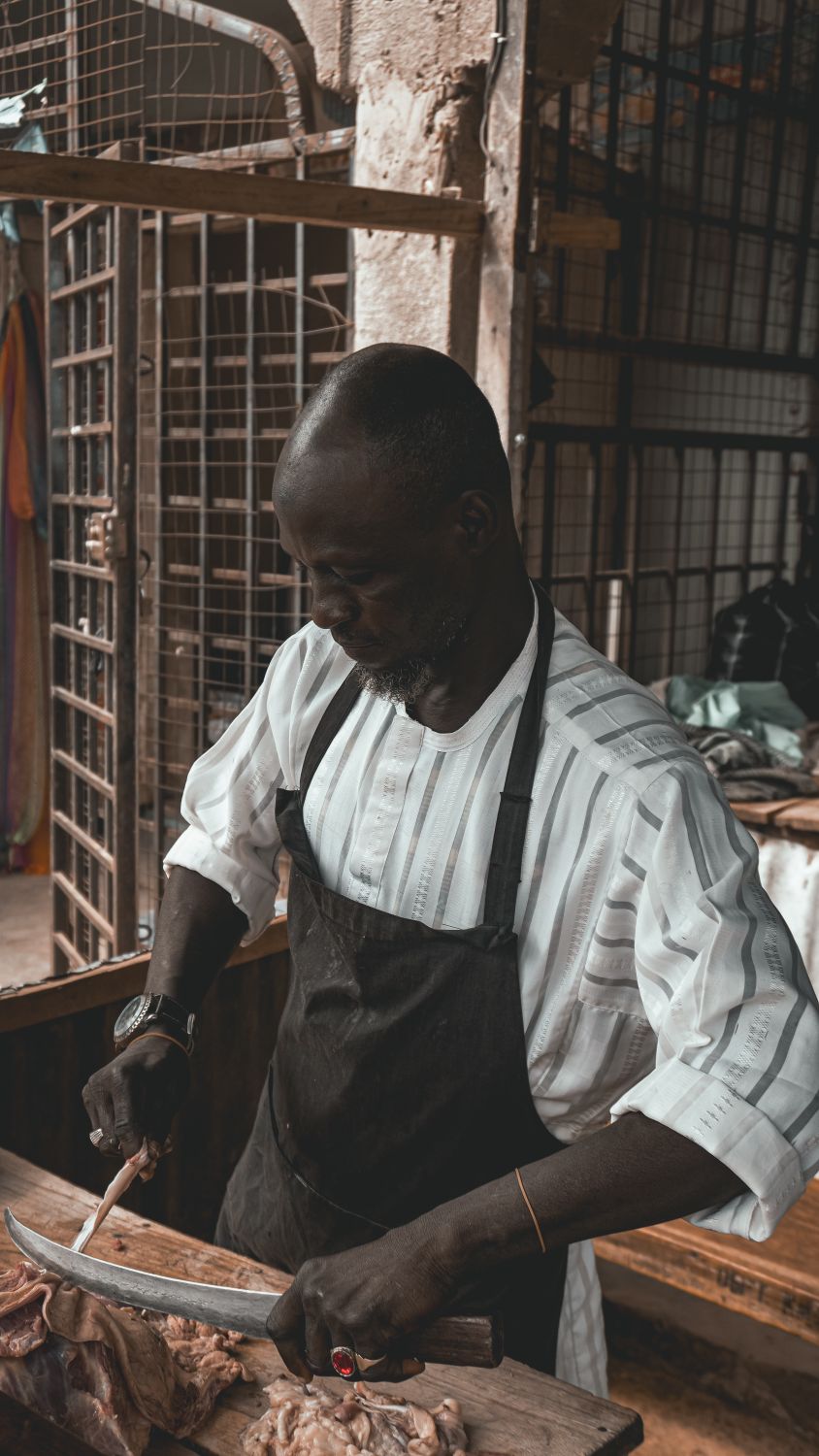 Butcher Cutting Meat at Kano Market · Free Stock Photo