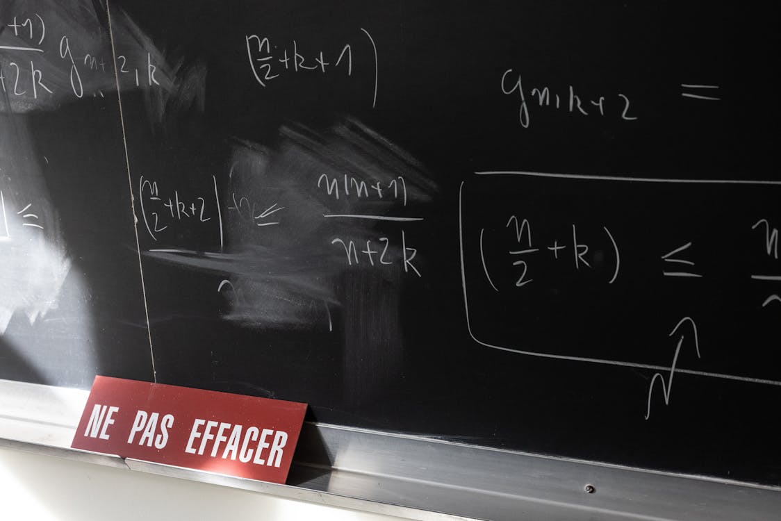 Mathematical Formulas on Blackboard with Warning Sign · Free Stock Photo