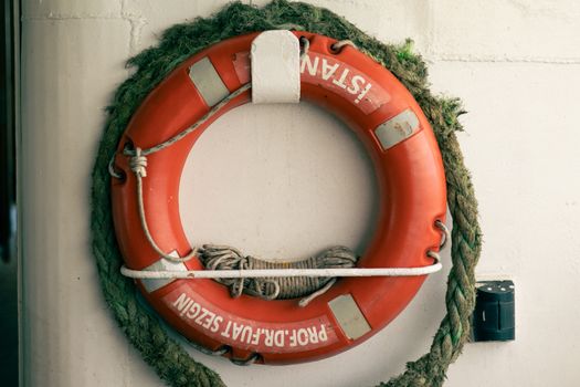 Vintage Lifebuoy with Rope on Wall Display