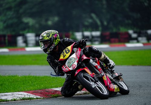 Free Dynamic capture of a motorcycle race in Tarlac City, showcasing agility and speed on a wet track. Stock Photo