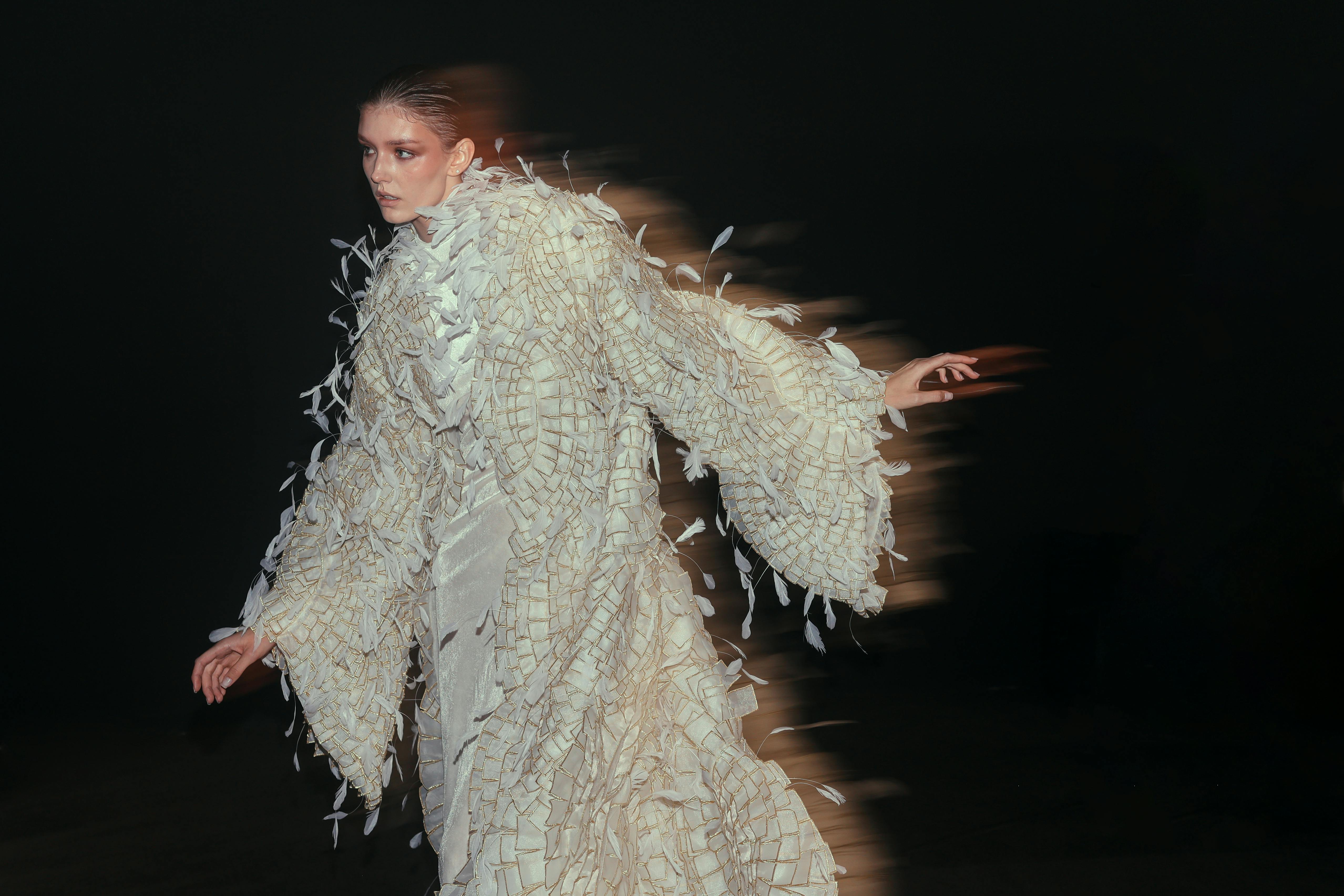 Captivating fashion portrait with a unique motion blur effect creating dynamic movement.