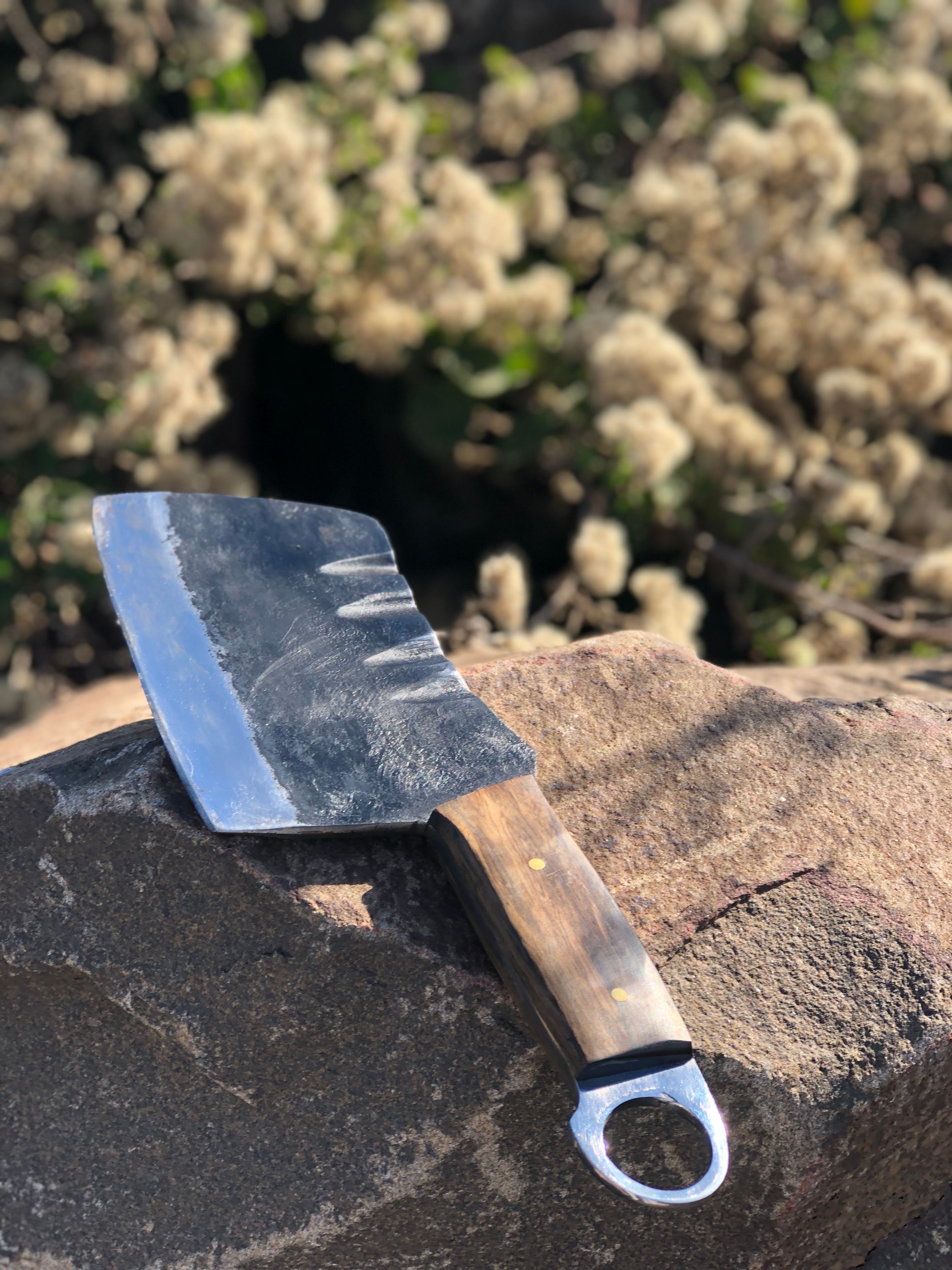 Rustic Cleaver on Rock in Natural Setting · Free Stock Photo