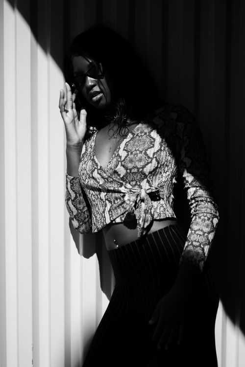 Free Stylish woman posing in a modern black and white editorial fashion photo. Stock Photo