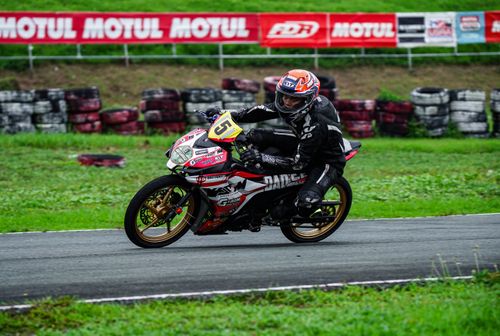 Free Exciting motorcycle race action captured at a vibrant track in Tarlac City, Philippines. Stock Photo