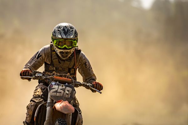 Dirt bike racer speeding through a dusty trail, Stephen Leonardi on Pexels