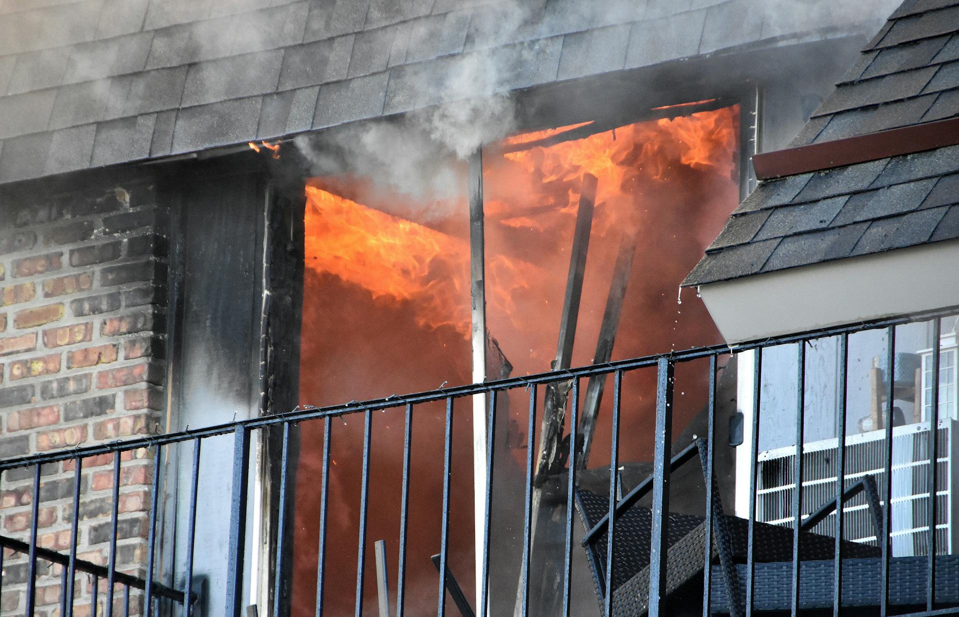 Intense Apartment Fire Engulfs Building Window