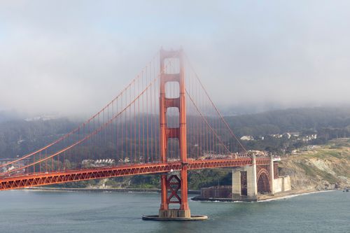 Free Golden Gate Bridge with dense morning fog and scenic landscape in San Francisco. Stock Photo