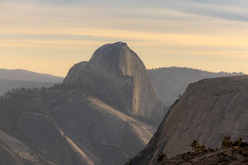 Free Dramatic sunset view of Half Dome in Yosemite, showcasing iconic granite rock formations. Stock Photo