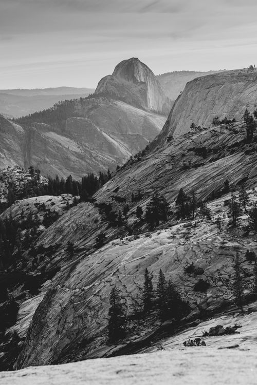 Free Black and white landscape of Yosemite's Half Dome, showcasing dramatic rock formations. Stock Photo