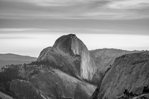 Free Black and white image featuring Half Dome in Yosemite National Park's mountainous landscape. Stock Photo