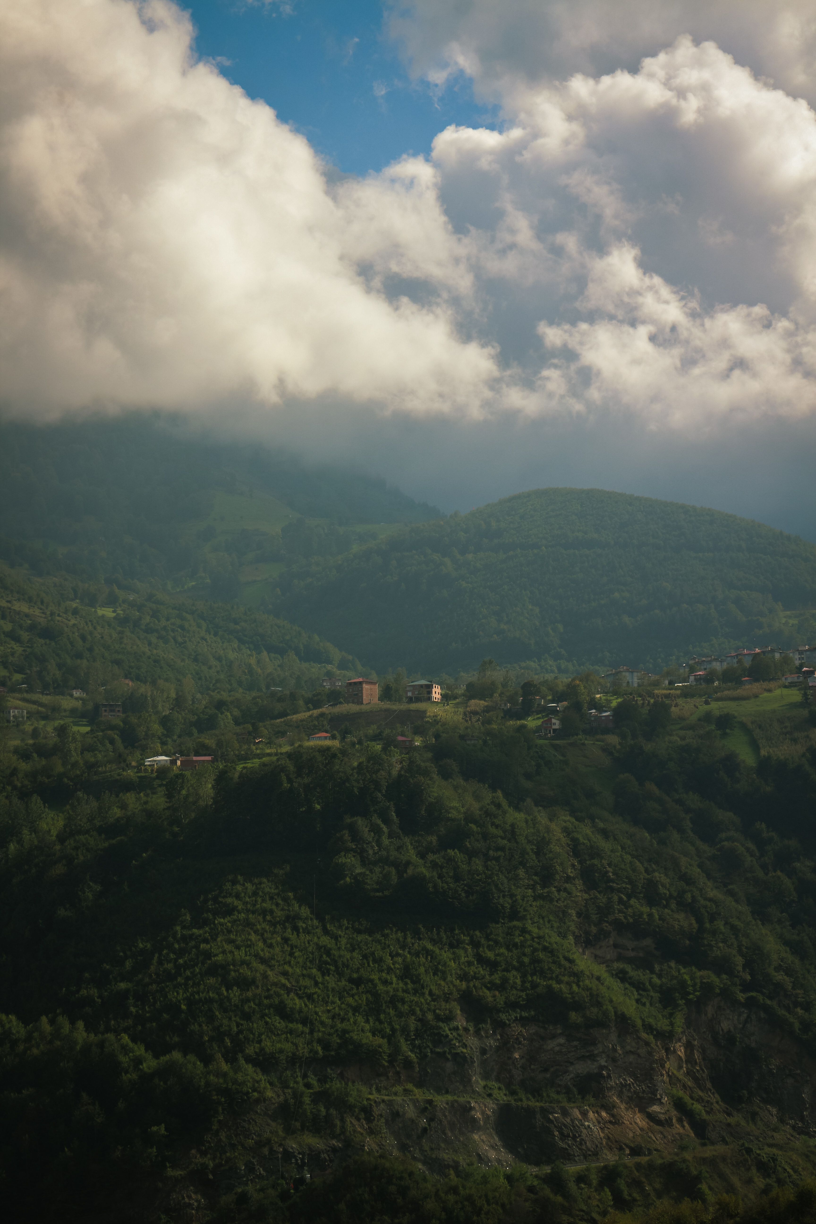Cloudy Mountain Landscape with Lush Vegetation · Free Stock Photo