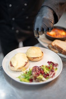 Artisan beef sliders with cheese sauce and salad, prepared in New Orleans kitchen.