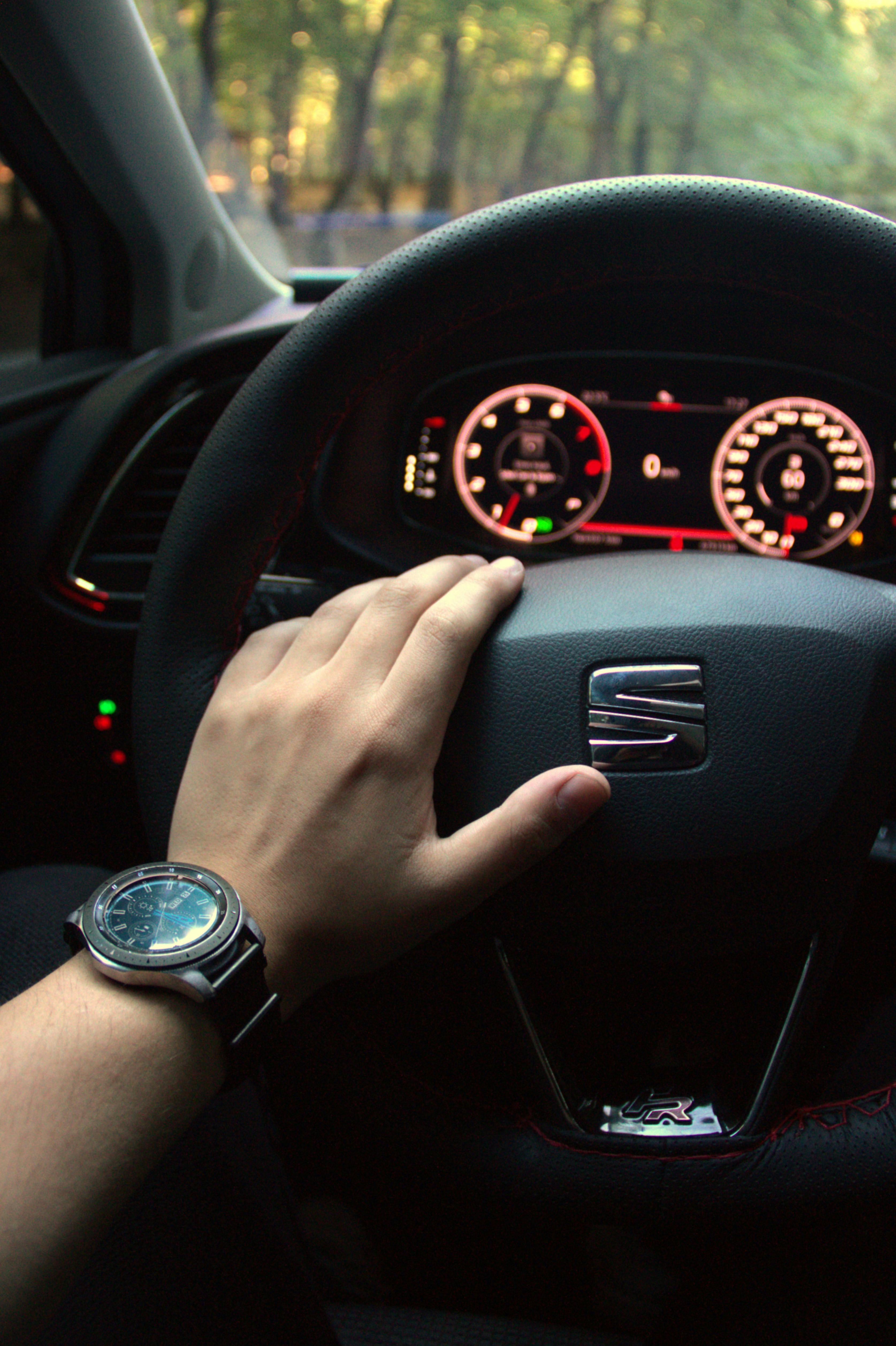 Free Close-up of a hand holding a car steering wheel, dashboard visible, in Istanbul. Stock Photo