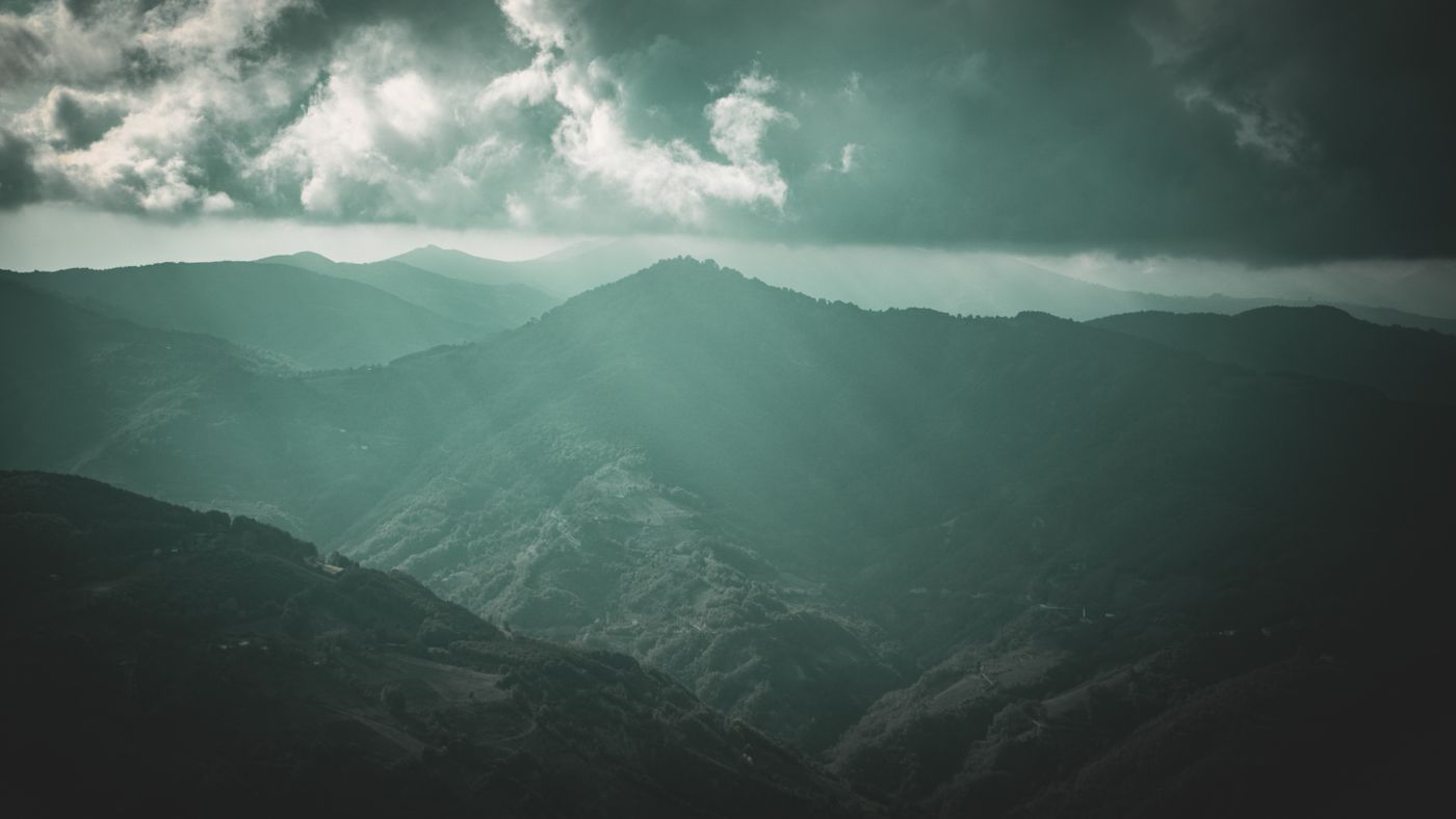Mist over green mountains