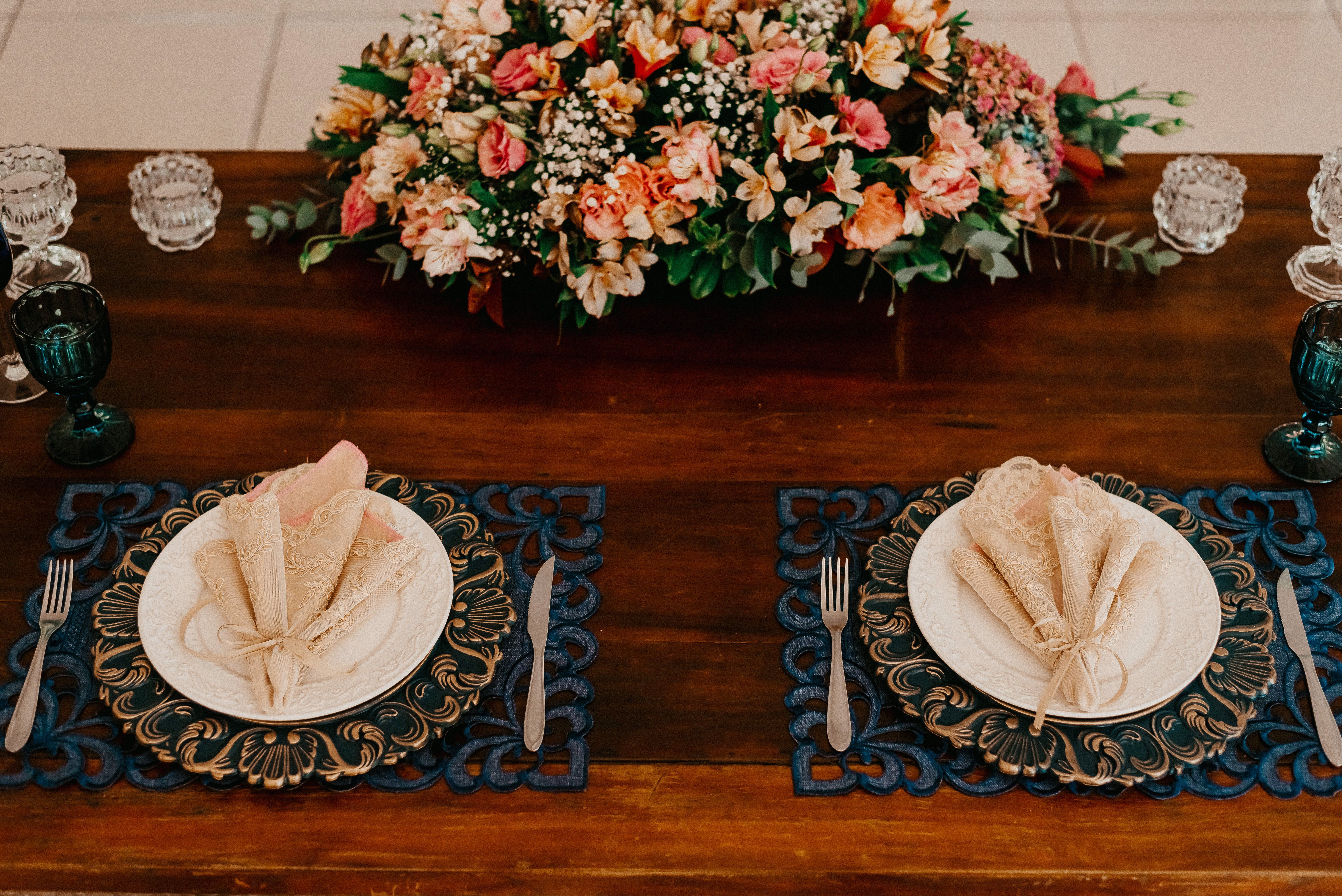 Elegant table setup with a lush floral centerpiece, perfect for weddings or special events.