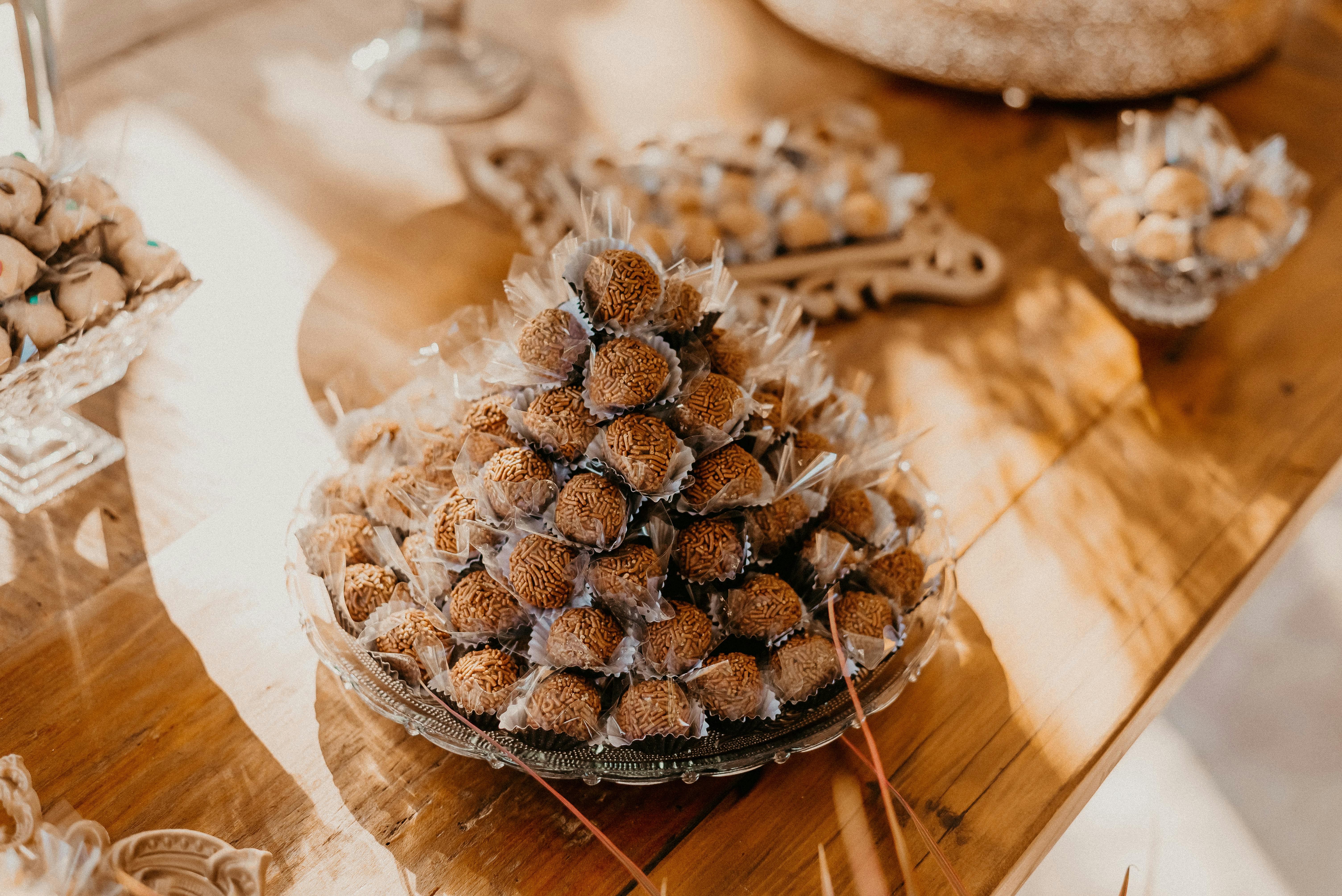 Delicious brigadeiros displayed elegantly on a wooden table, perfect for celebrations.