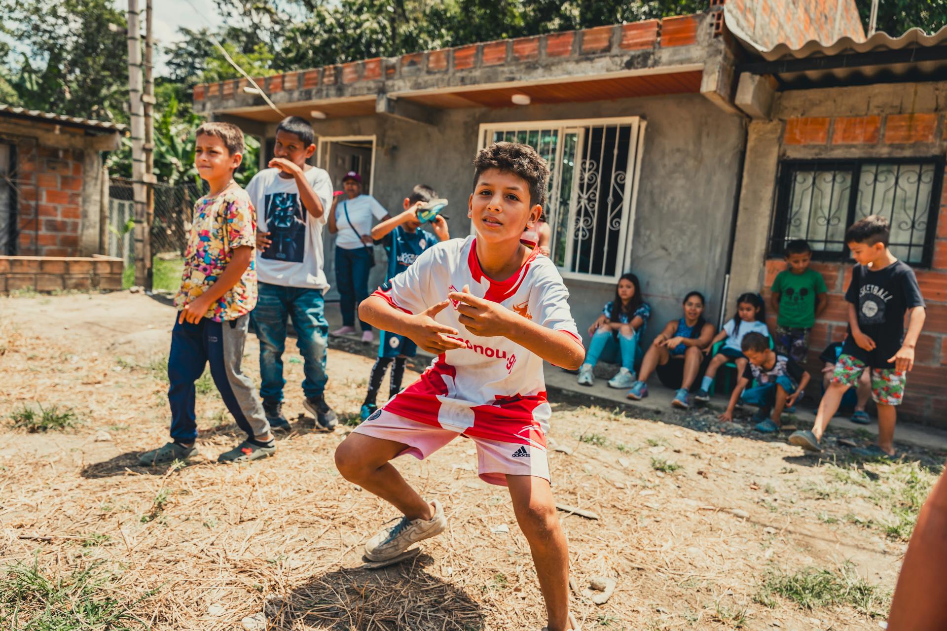 Children Playing in Rustic Neighborhood Street