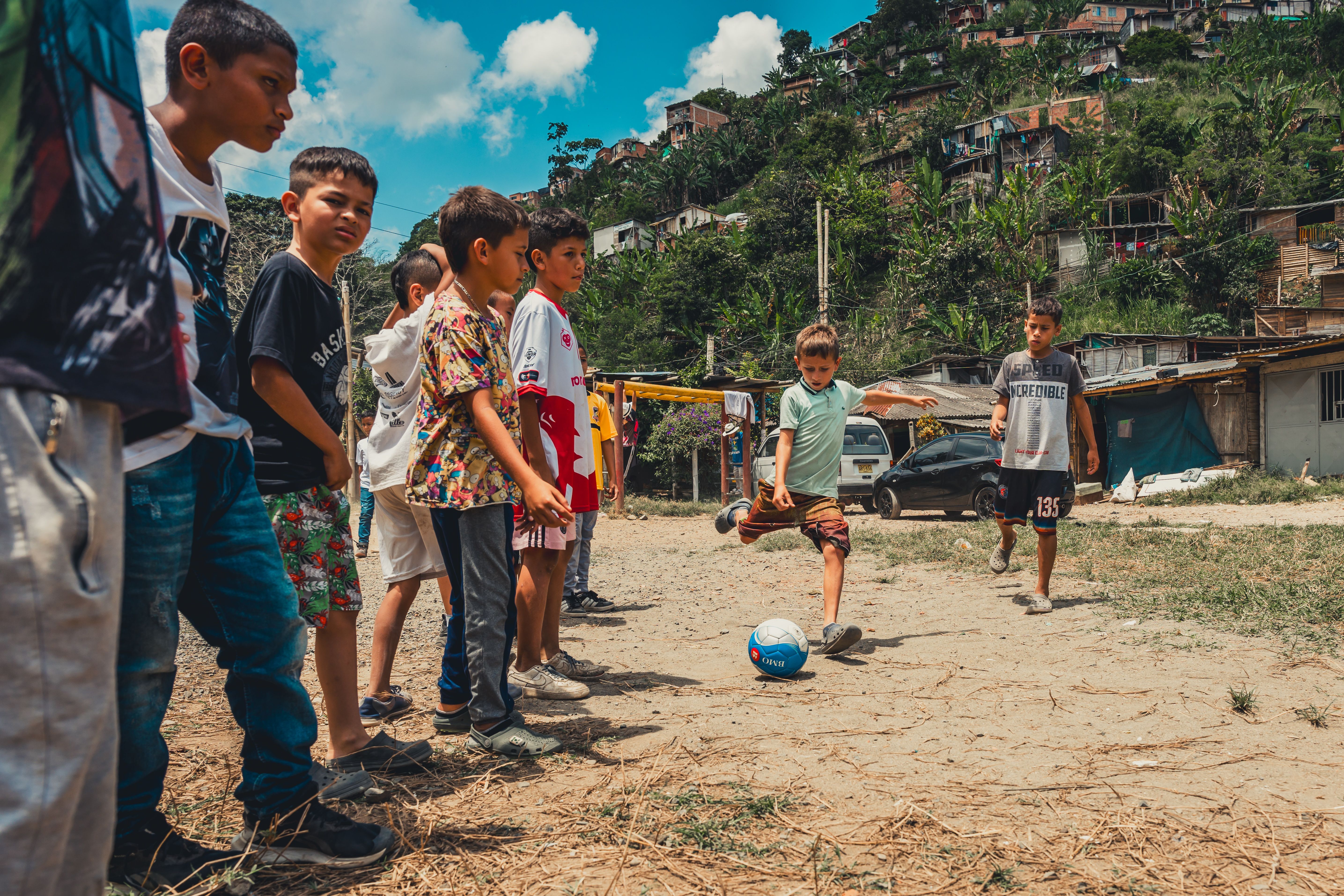 Children Playing Soccer in Rural Community · Free Stock Photo
