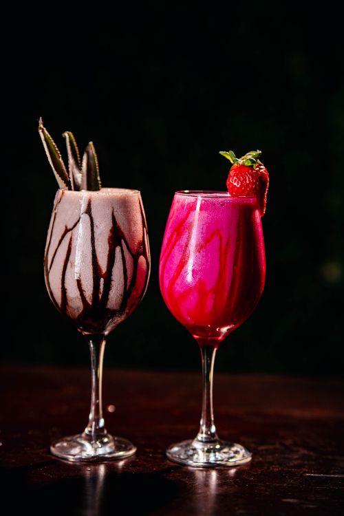 Free Vibrant cocktails with delicious toppings on a dark backdrop. Stock Photo
