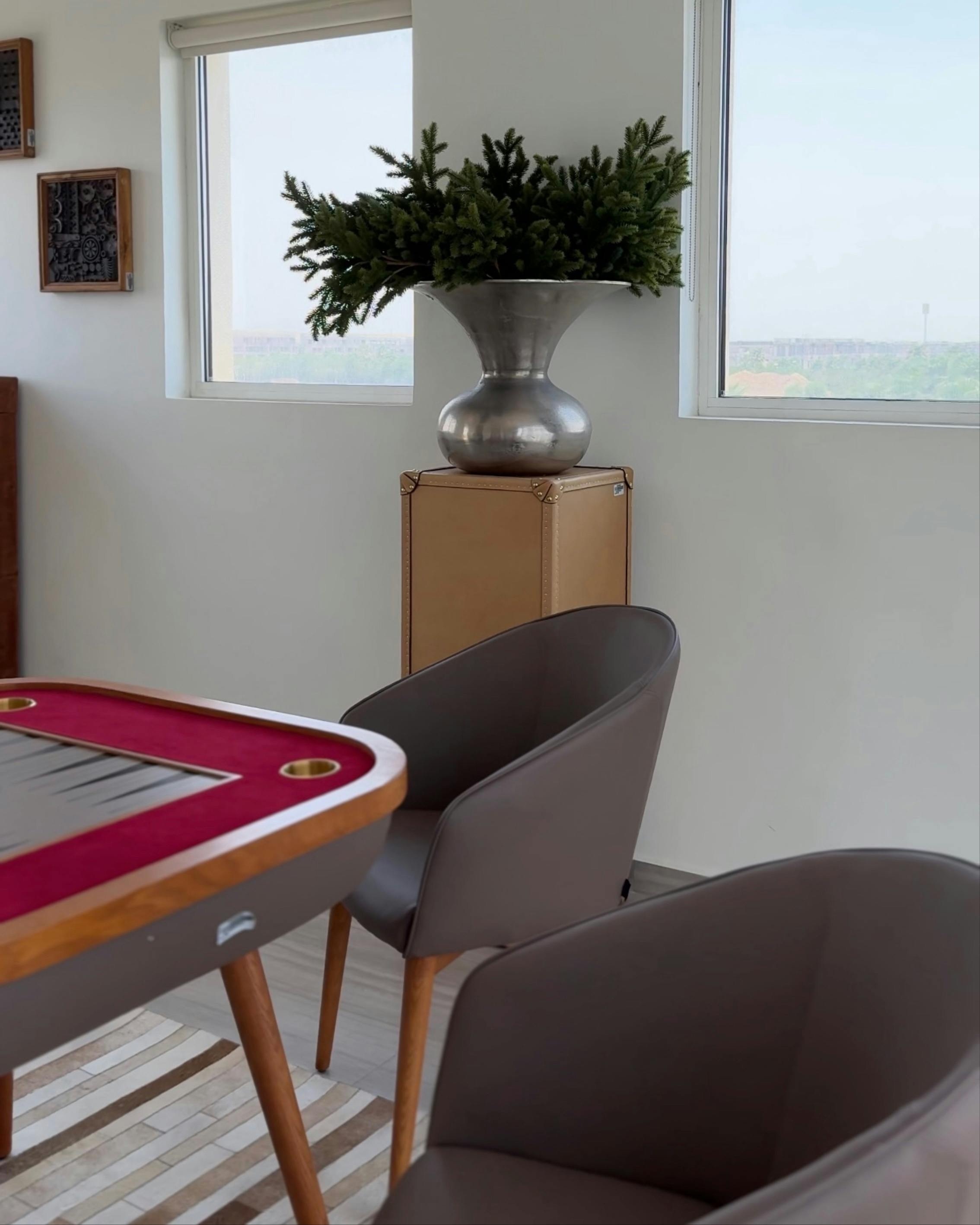 modern interior with poker table and greenery