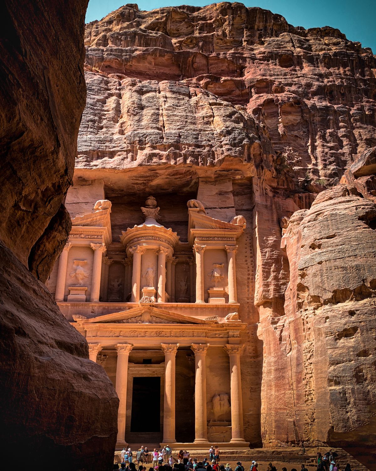 The rock-carved Treasury facade at Petra in warm sandstone light