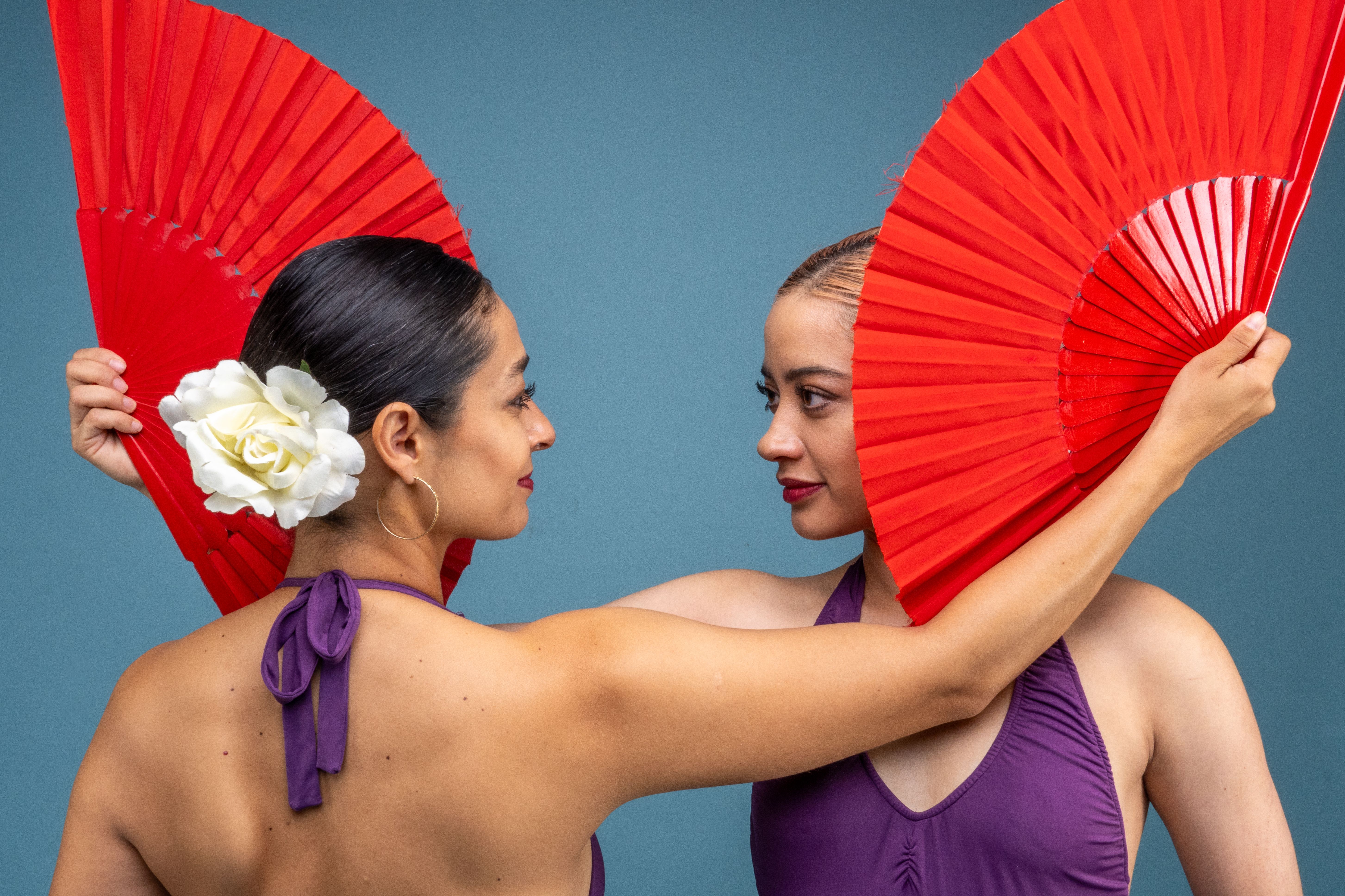 Two Women Dancing with Red Fans in Mexico Studio · Free Stock Photo
