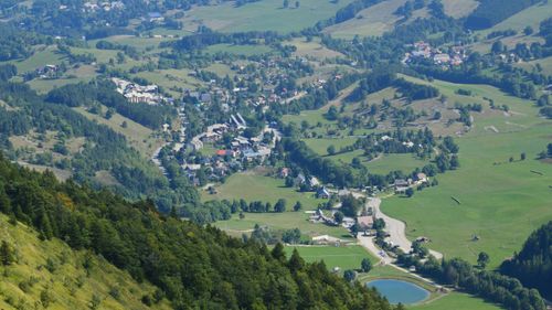 Free Scenic aerial view of Gresse-en-Vercors village in France surrounded by lush greenery. Stock Photo